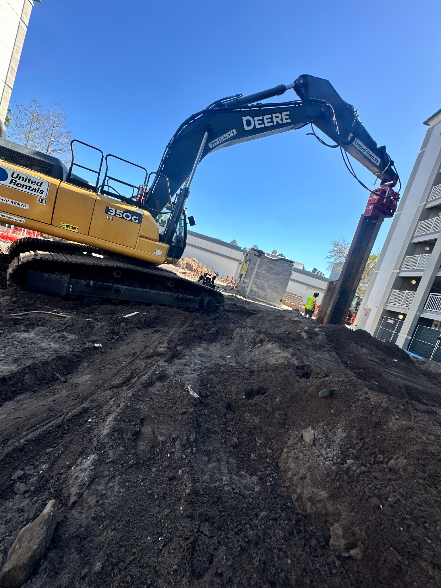 Excavator performing field work on a job site